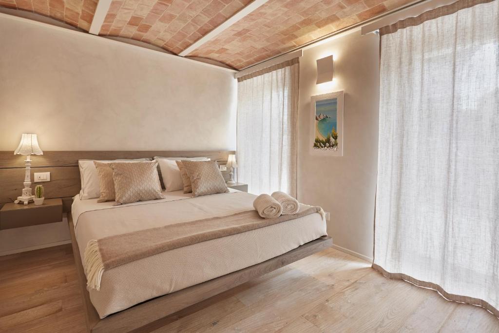 Postel nebo postele na pokoji v ubytování Nilù relais