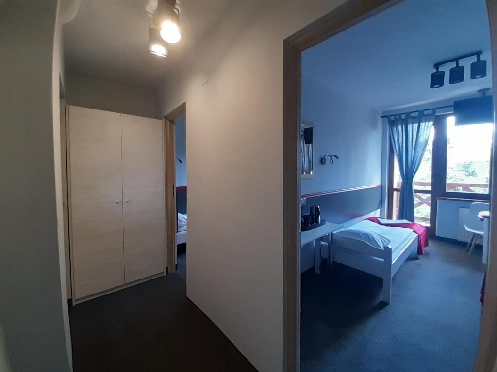 Postel nebo postele na pokoji v ubytování Pensjonat Maja