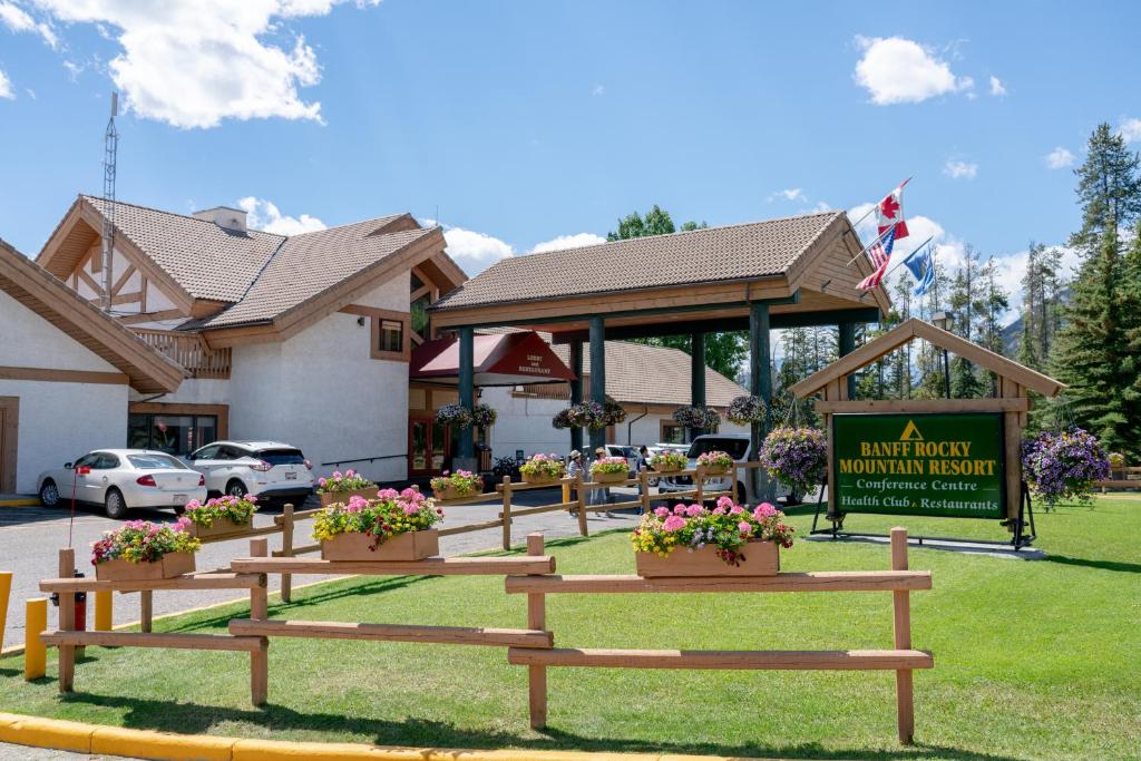 a group of benches in front of a building at Banff Rocky Mountain Resort in Banff