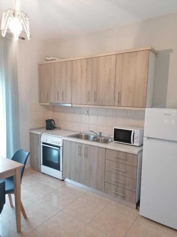 A kitchen or kitchenette at Green Island Residence
