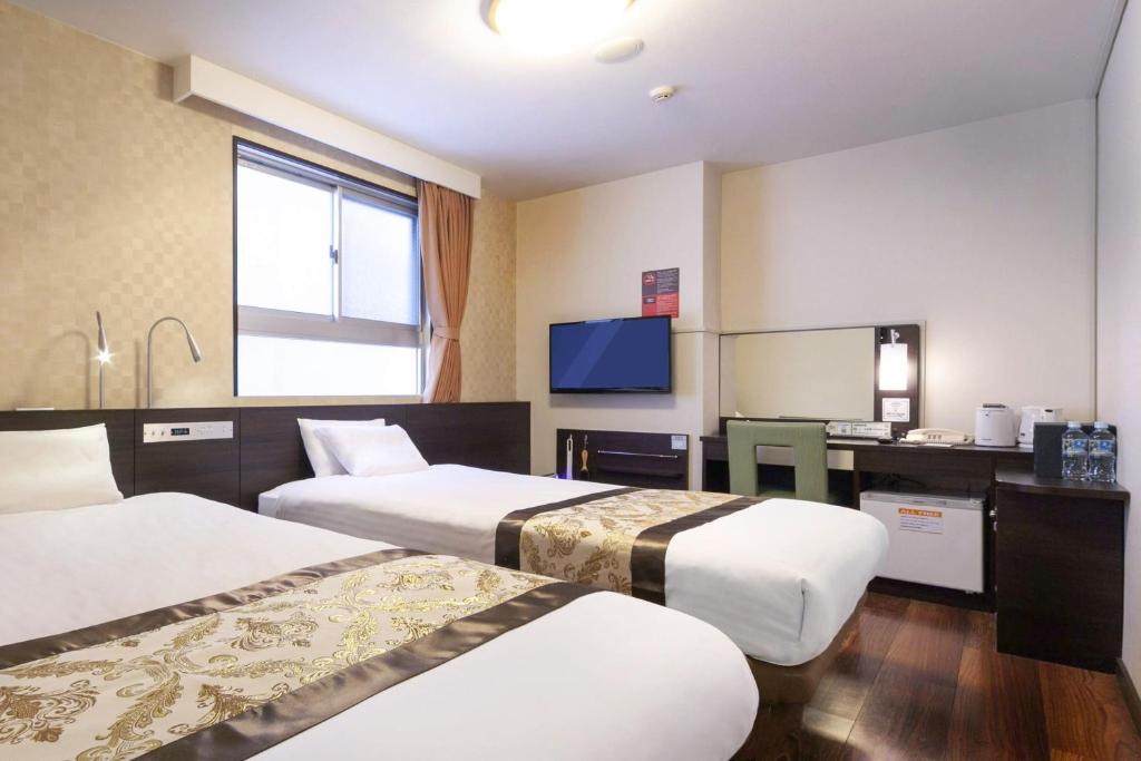 TV a/nebo společenská místnost v ubytování Dotonbori Hotel