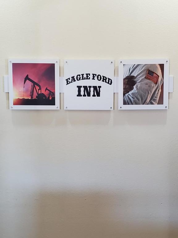 a group of three pictures on a wall at Eagle Ford Inn in Floresville