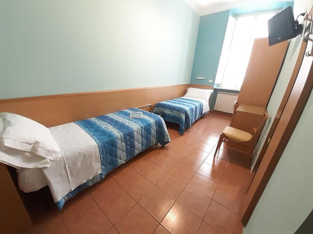 Postel nebo postele na pokoji v ubytování Hotel Alba Torino centro