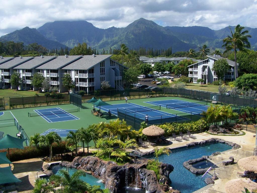 an aerial view of a tennis court at a resort at The Cliffs Club at Princeville in Princeville
