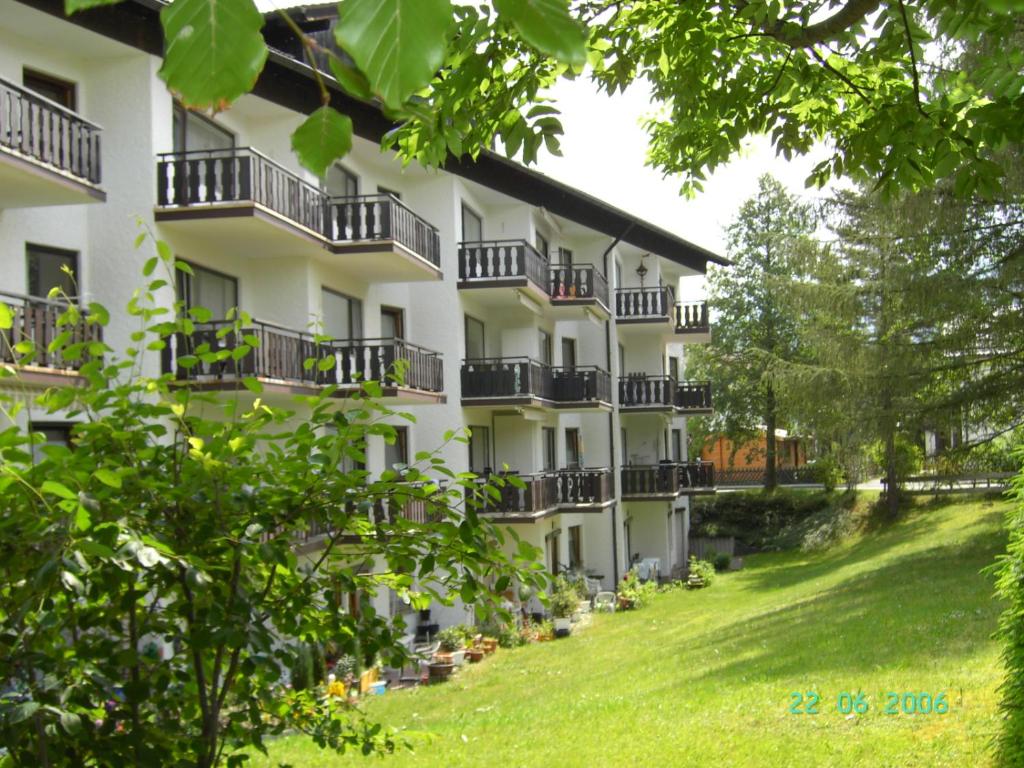 an apartment building with balconies on a lawn at Sonnenhof in Füssen