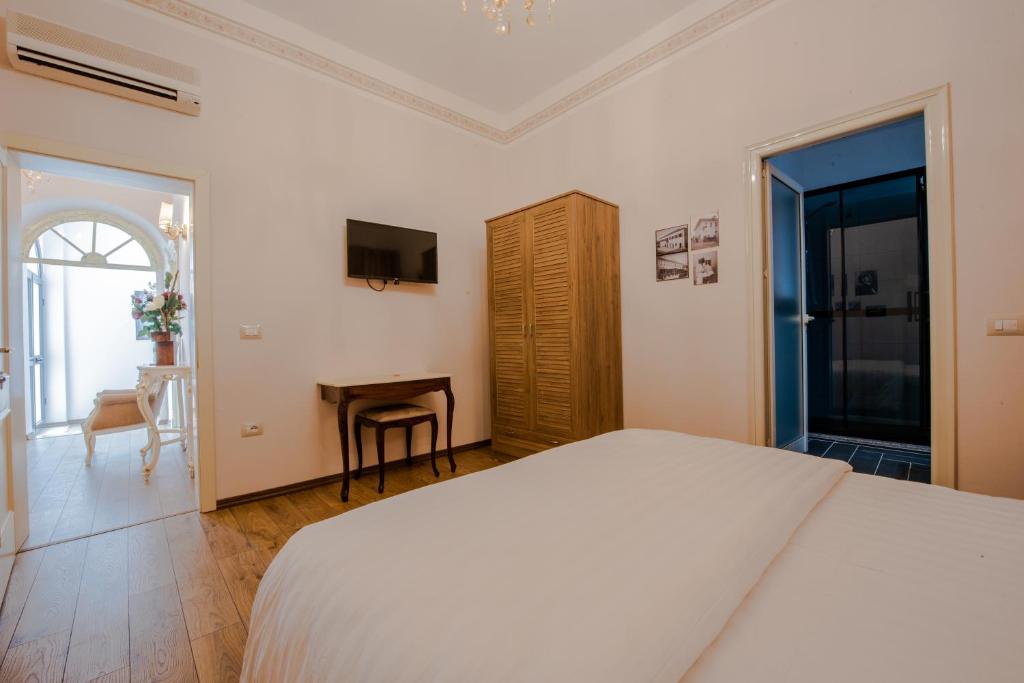 Postel nebo postele na pokoji v ubytování Hotel Loredano