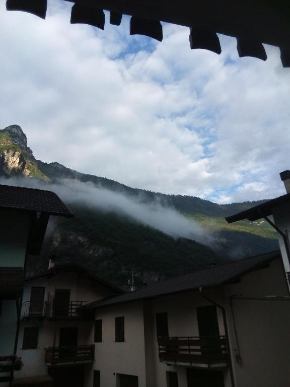 a view of the mountains from a window of a building at B&B Stella Al Pina in Tezze