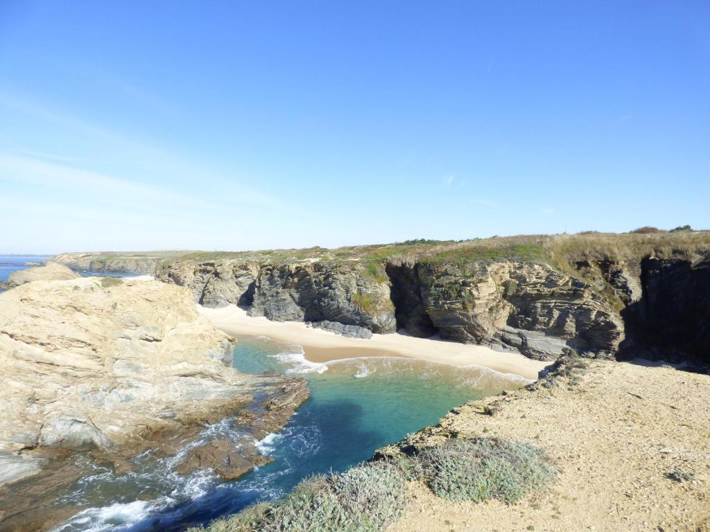 an aerial view of a beach on a cliff at Milfontes Paradise in Vila Nova de Milfontes