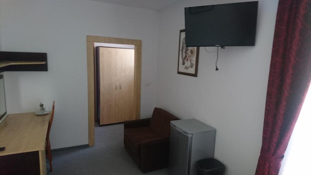 TV a/nebo společenská místnost v ubytování Hotel Antler