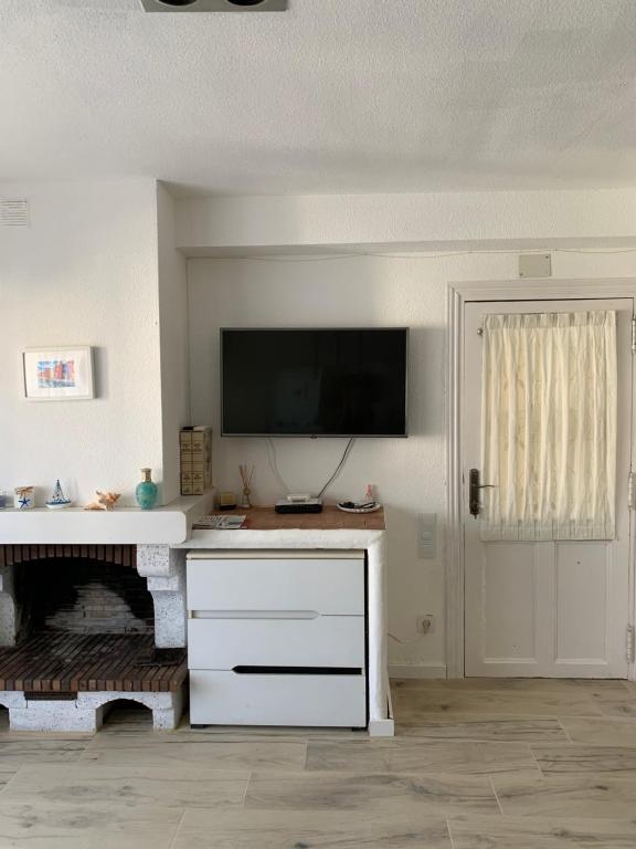 Televízia a/alebo spoločenská miestnosť v ubytovaní Apartamento in Cullera. Spain