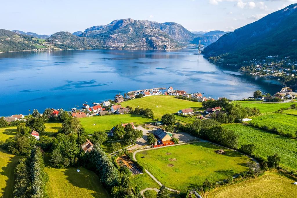 an aerial view of a village on the shore of a lake at Lysefjorden - Gøysa Gard in Forsand