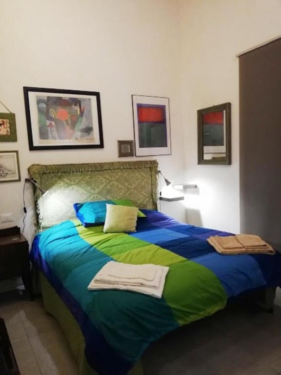 Posteľ alebo postele v izbe v ubytovaní Arimatea Casa Vacanza