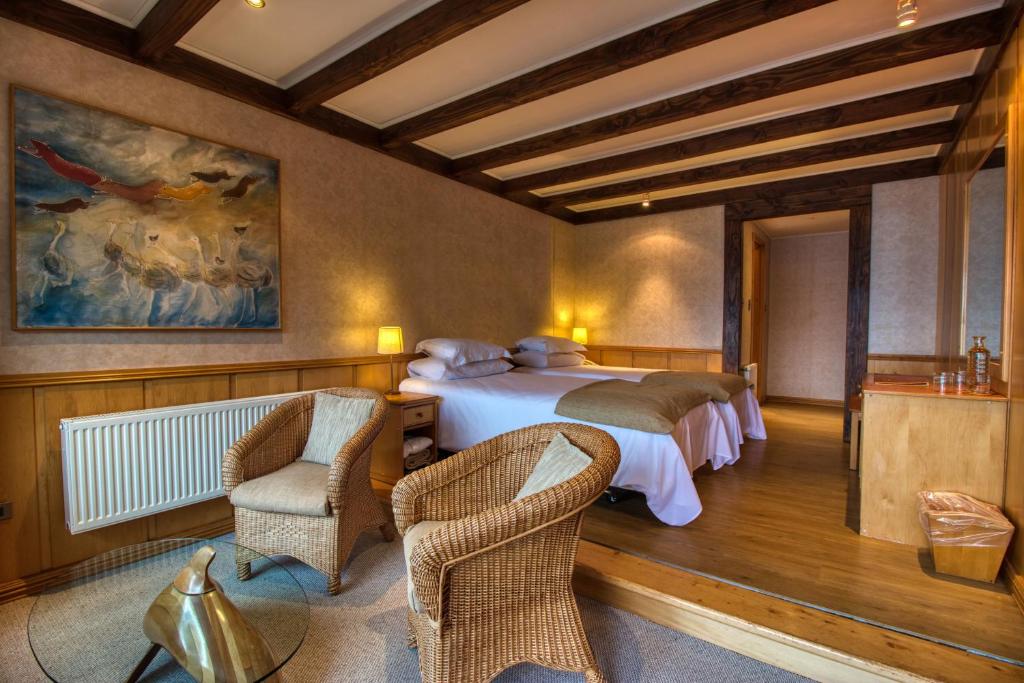 Postel nebo postele na pokoji v ubytování Puyuhuapi Lodge & Spa