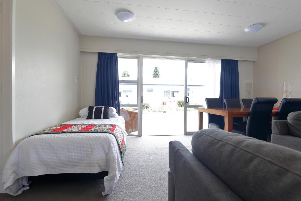 Postel nebo postele na pokoji v ubytování Aden Motel
