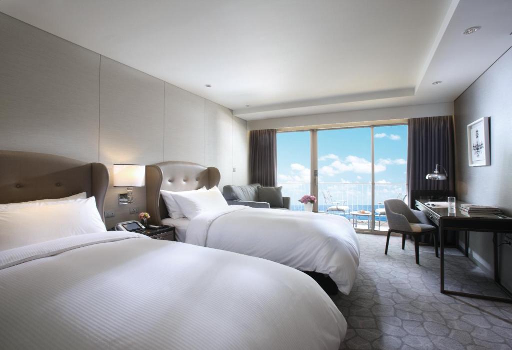 Postel nebo postele na pokoji v ubytování Paradise Hotel Busan