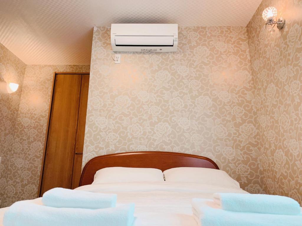 Postel nebo postele na pokoji v ubytování Allcomein Hotel Akihabara
