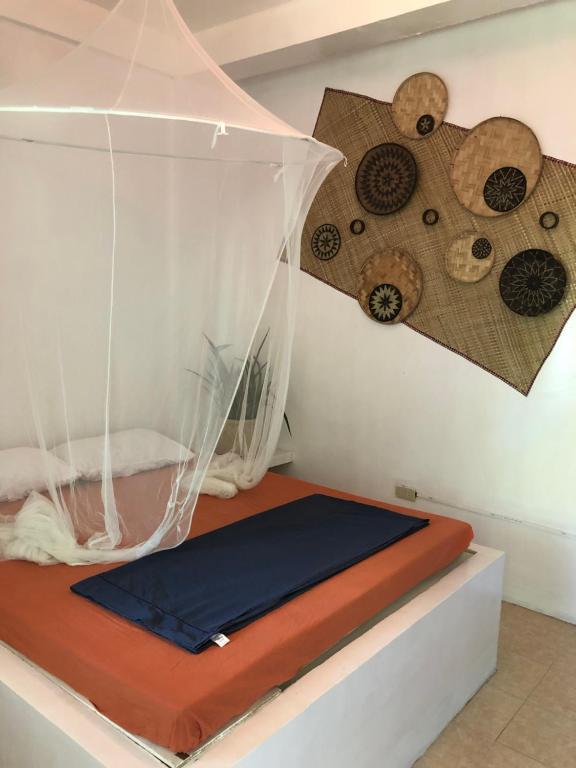 Postel nebo postele na pokoji v ubytování Puerto Galera Hostel