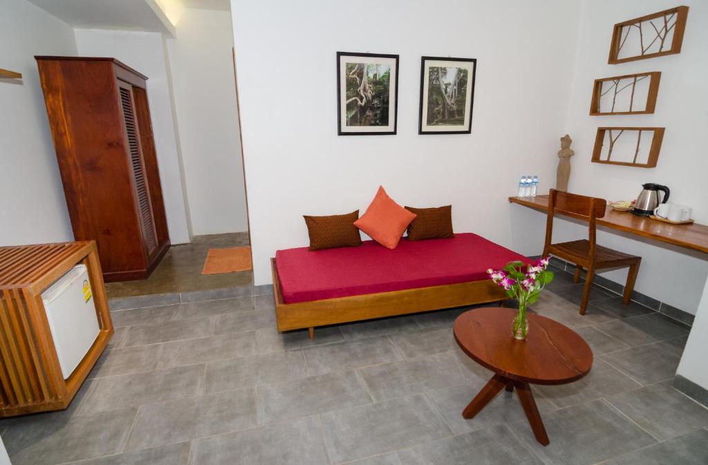 Postel nebo postele na pokoji v ubytování Neth Socheata Hotel