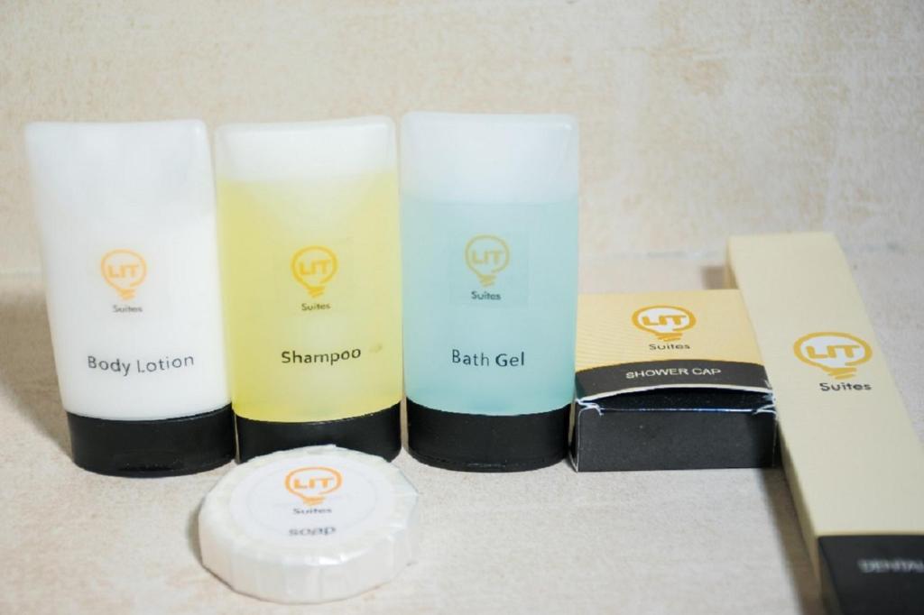 a group of four beauty products sitting on a counter at Lit Suites in Abuja