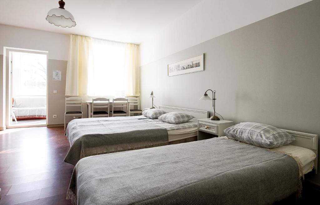 Postel nebo postele na pokoji v ubytování Promenaadi Villa