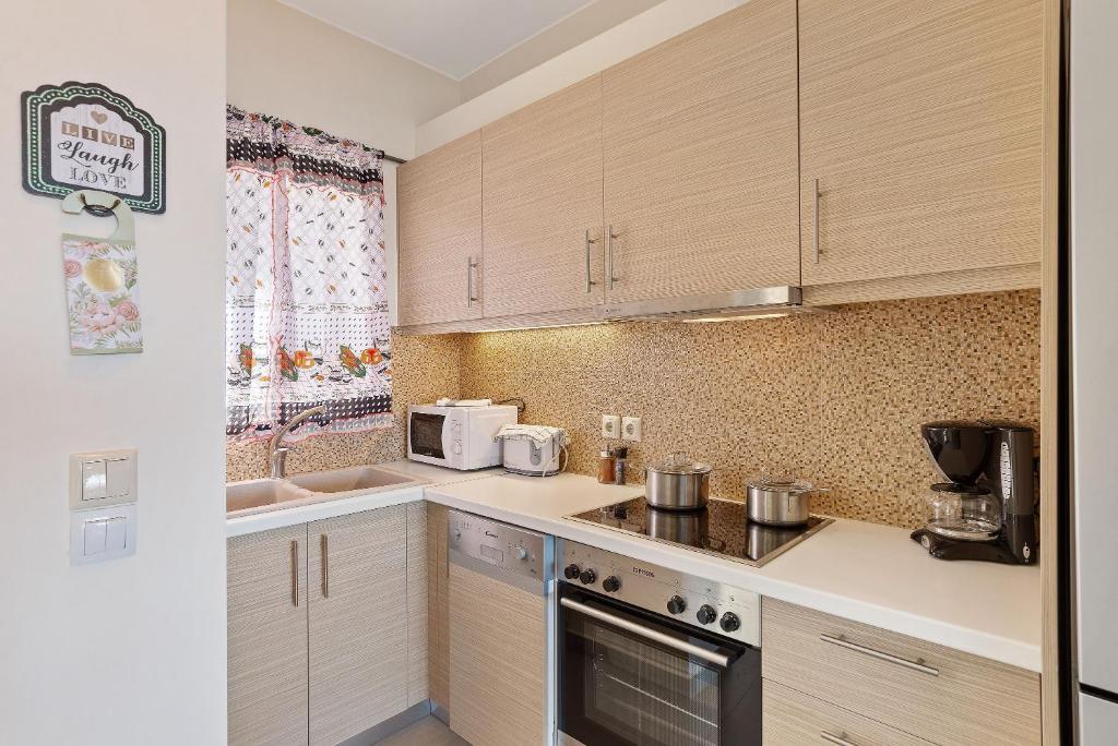 A kitchen or kitchenette at Almyrida Panorama view house BY APOKORONAS-VILLAS