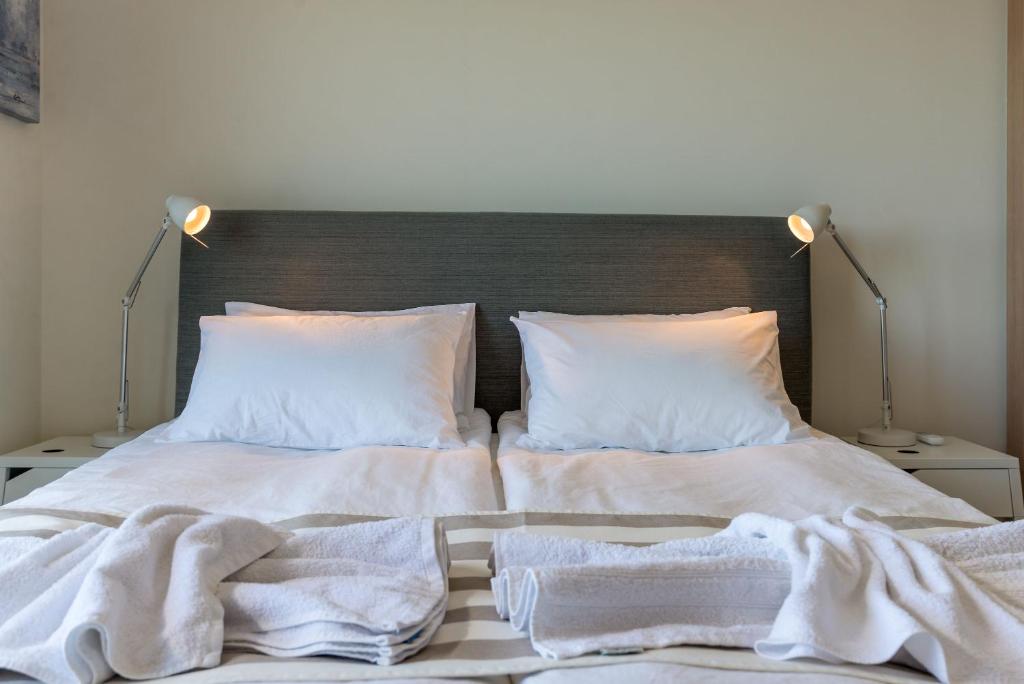A bed or beds in a room at Almyrida Panorama view house BY APOKORONAS-VILLAS