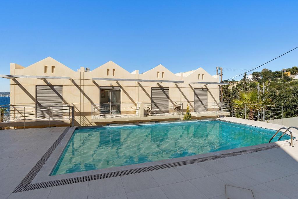 The swimming pool at or close to Almyrida Panorama view house BY APOKORONAS-VILLAS