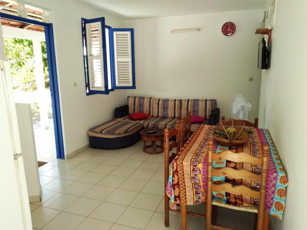 Una cama o camas en una habitación de Appartement confortable à Le Marin, jardin, 80 m², proche mer