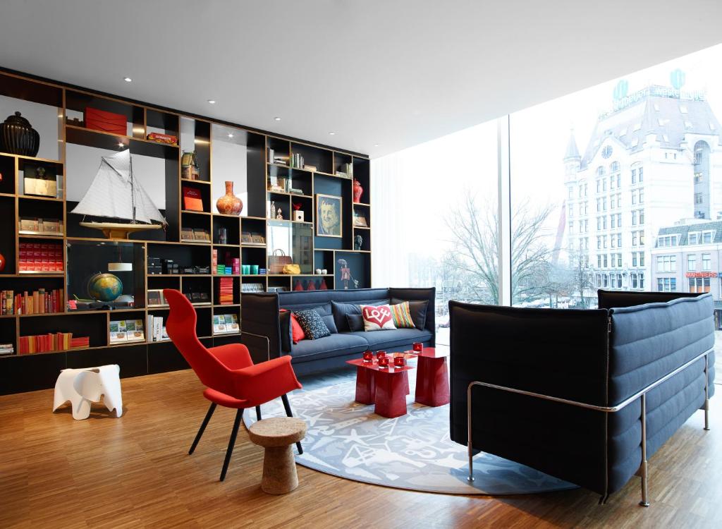 
a living room filled with furniture and a coffee table at citizenM Rotterdam in Rotterdam
