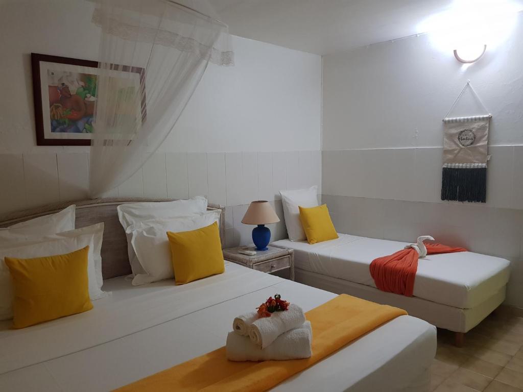 Postel nebo postele na pokoji v ubytování ROY'AL BEACH HOLIDAYS