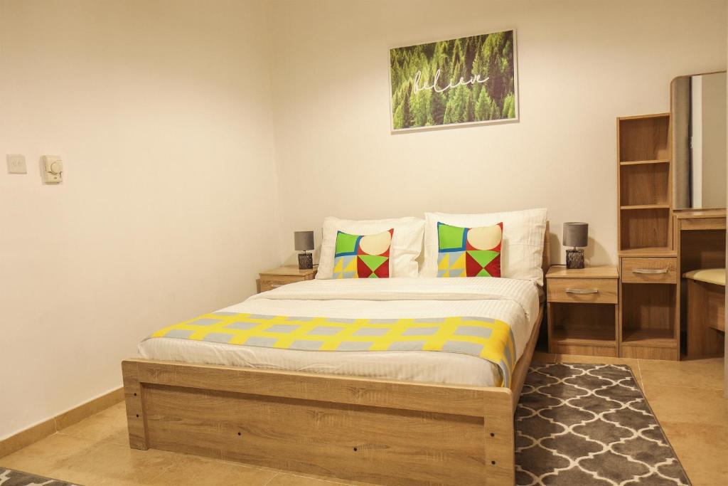 a bedroom with a bed in a room at SHH - Furnished Studio in Silicon Gates 1, Silicon Oasis in Dubai
