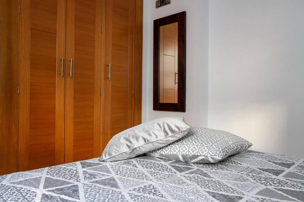 Łóżko lub łóżka w pokoju w obiekcie Penthouse Raggio