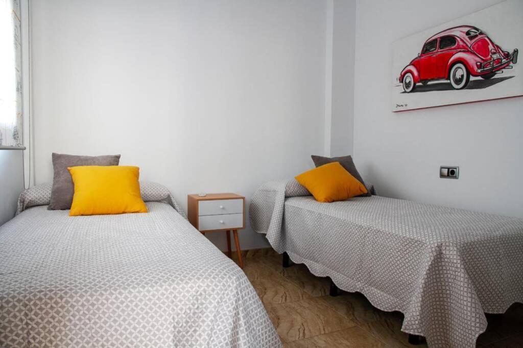 Łóżko lub łóżka w pokoju w obiekcie Penthouse Raggio
