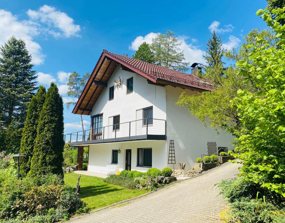 a white house with a red roof at Enjoy Hiking in Aufseß