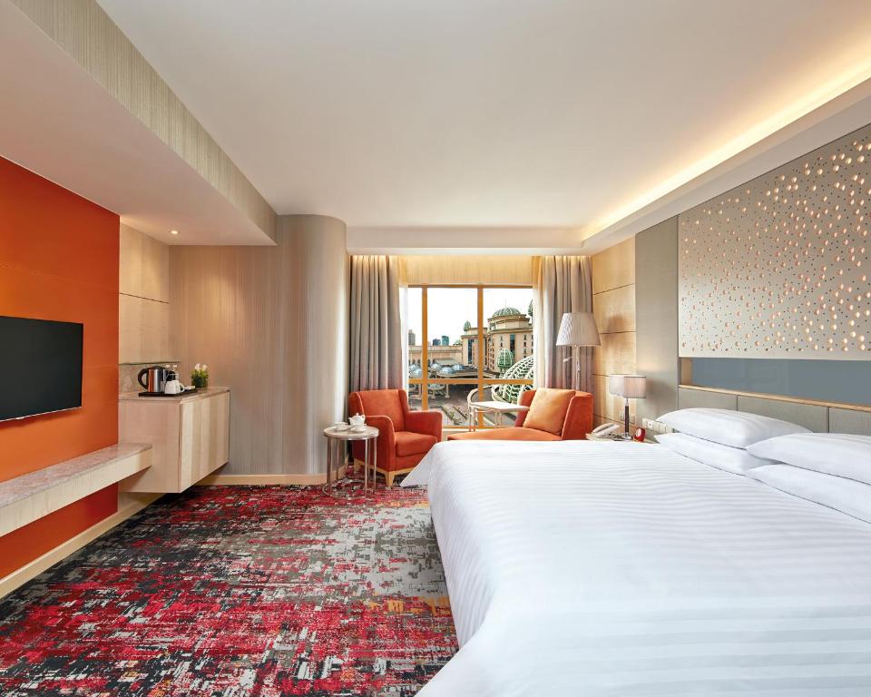 Postel nebo postele na pokoji v ubytování Sunway Pyramid Hotel