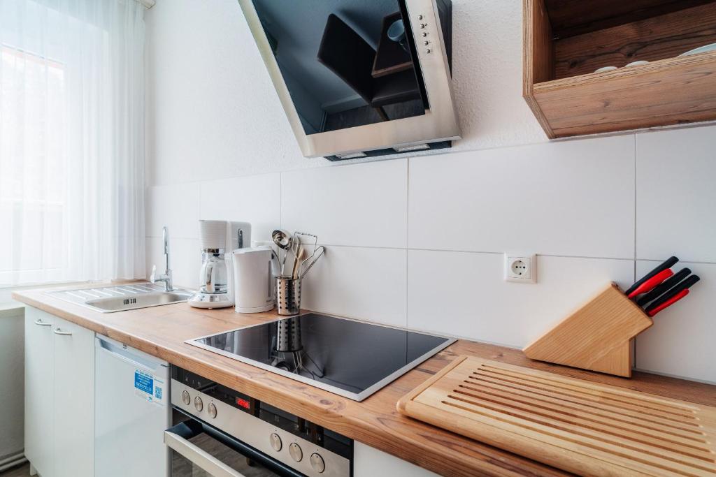 Kuchyň nebo kuchyňský kout v ubytování Bode_Apartments