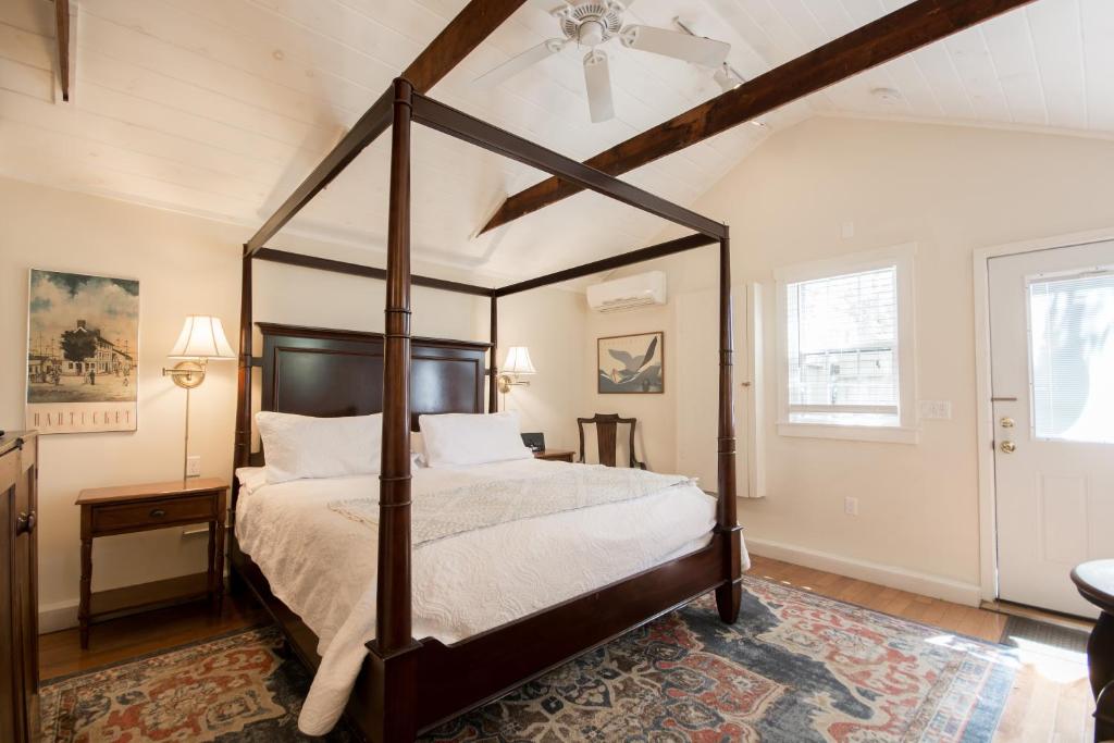 a bedroom with a canopy bed in a room at Marshall Slocum Inn in Newport