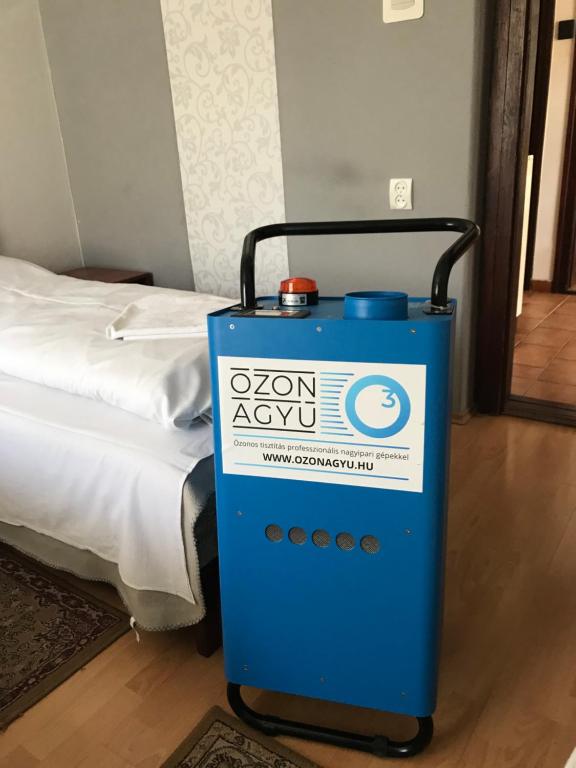 Postel nebo postele na pokoji v ubytování Erika Vendégház