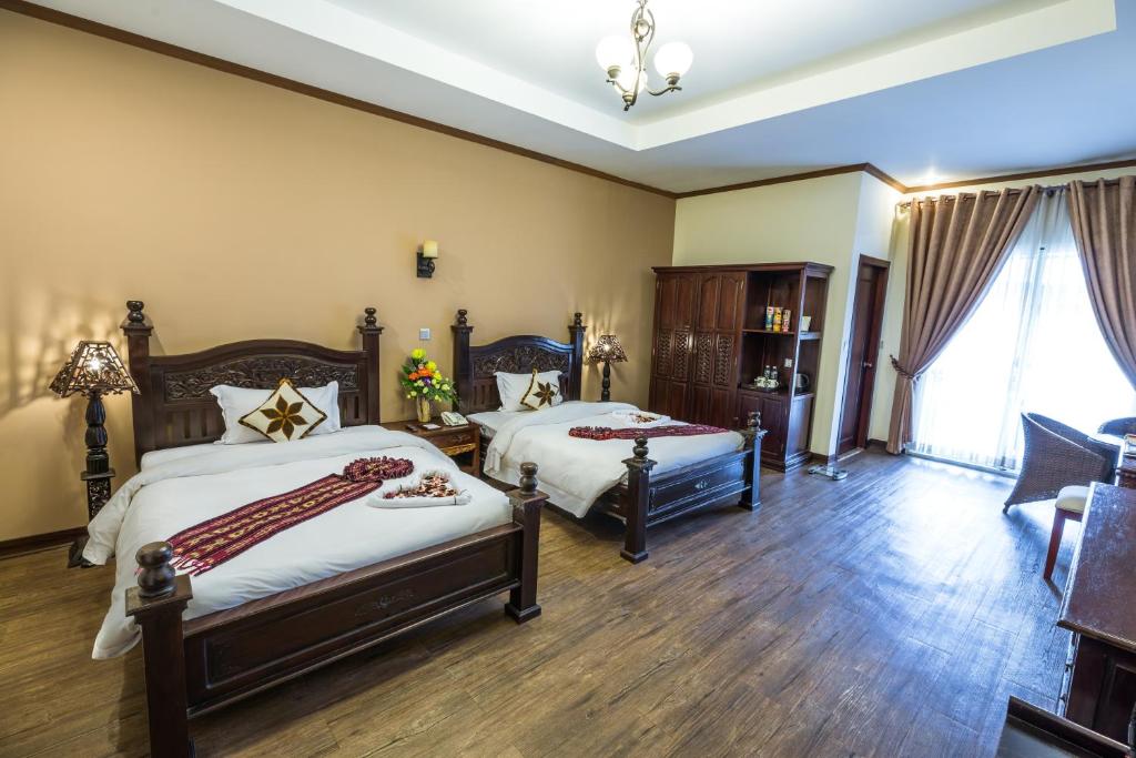 Postel nebo postele na pokoji v ubytování Bali Hotel