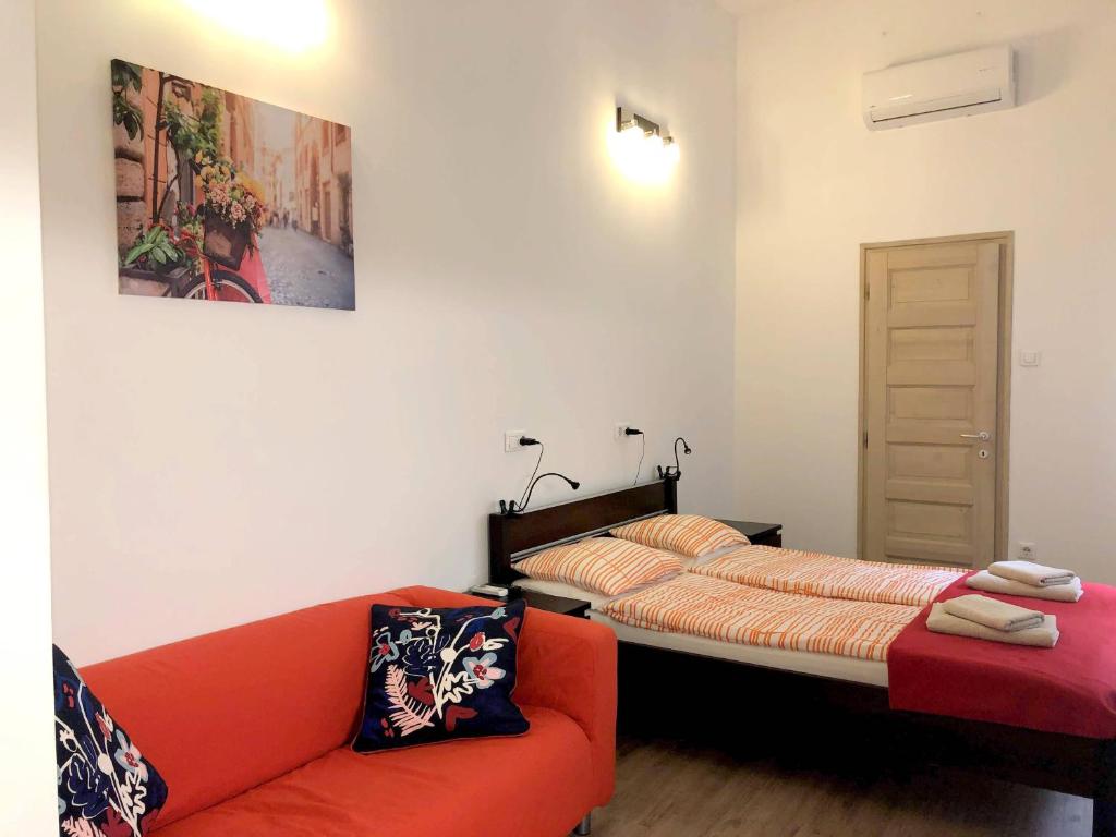A bed or beds in a room at Basilica Suites