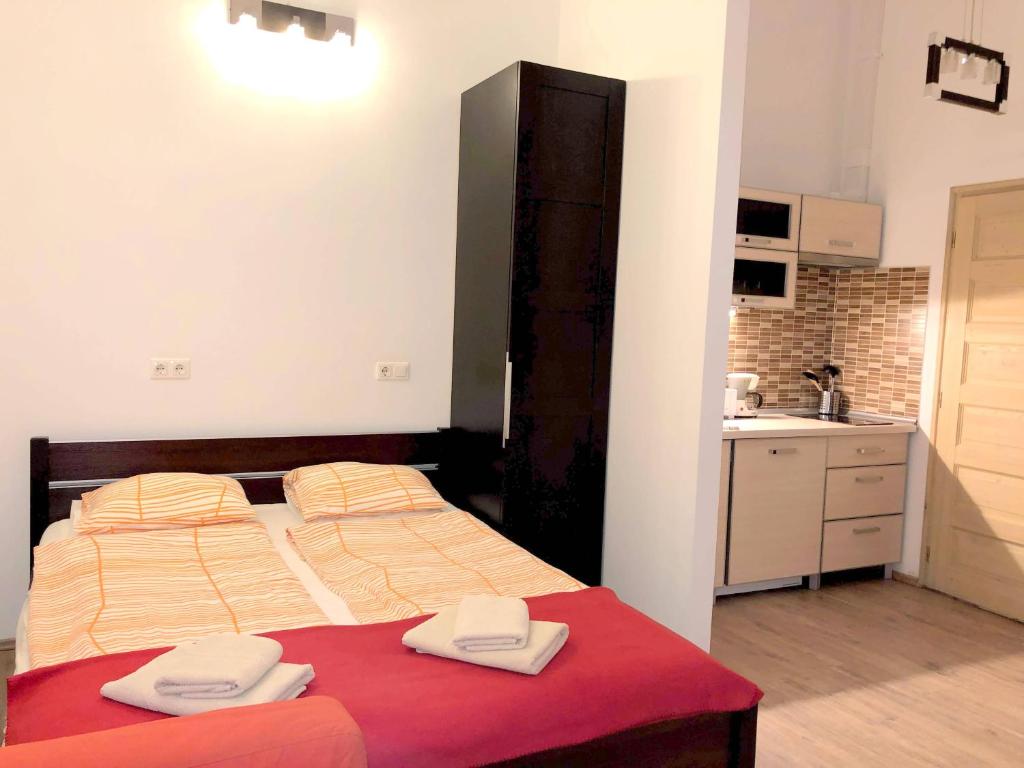 A bed or beds in a room at Basilica Suites