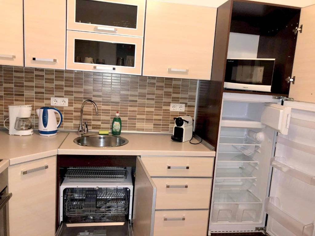 A kitchen or kitchenette at Basilica Suites
