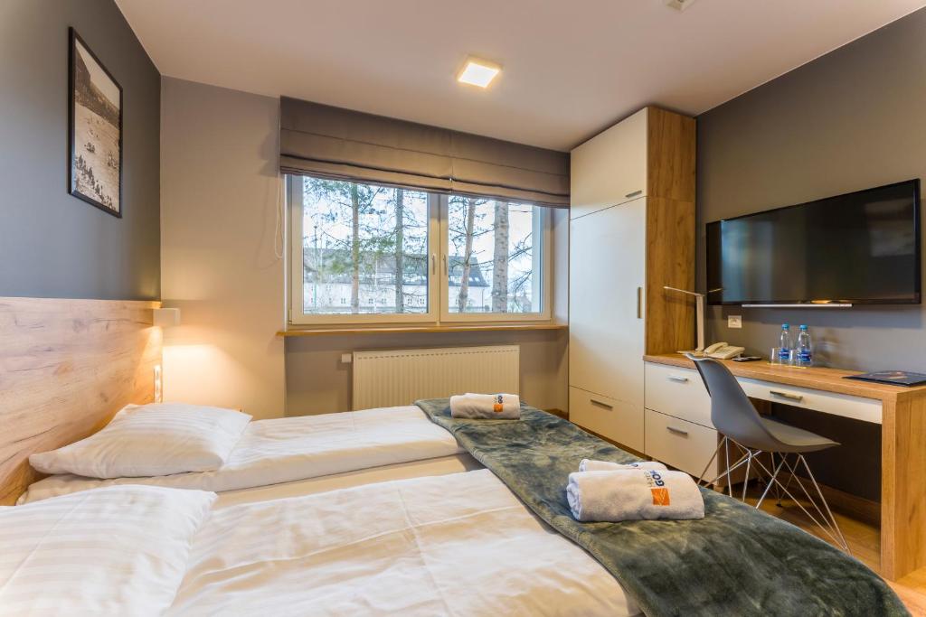 Posteľ alebo postele v izbe v ubytovaní Hotel***Gorce