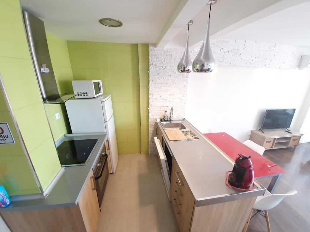 Kuchyň nebo kuchyňský kout v ubytování Piso familiar Salou