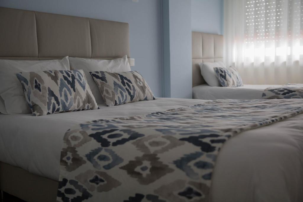 Cama ou camas em um quarto em Hotel Ancora Mar
