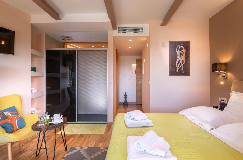 Postel nebo postele na pokoji v ubytování Panorama Exclusive Suites