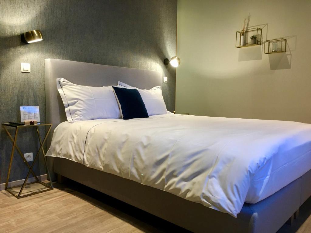Postel nebo postele na pokoji v ubytování Urban Nest