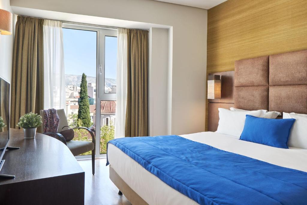 Posteľ alebo postele v izbe v ubytovaní Arion Athens Hotel