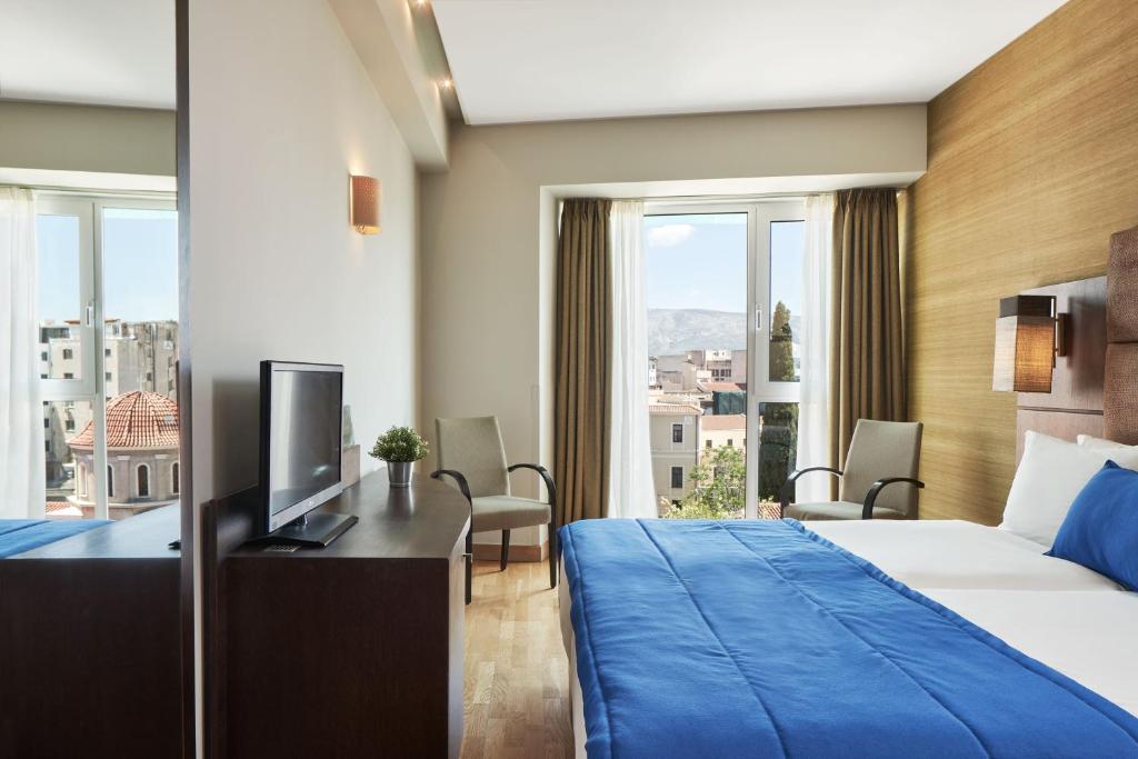 Posteľ alebo postele v izbe v ubytovaní Arion Athens Hotel