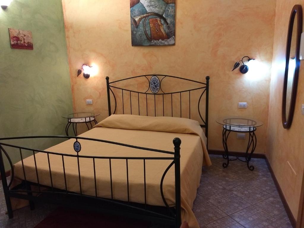 Postel nebo postele na pokoji v ubytování Palazzo Aprile